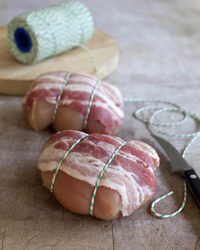 meat photography of chicken thighs tied with string