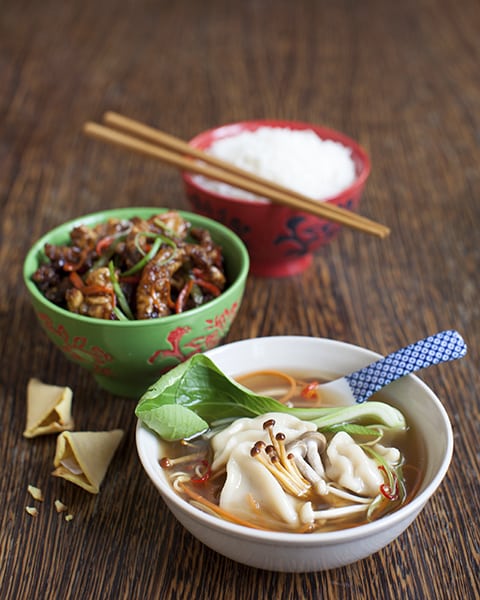 Chinese meal with pork dumpling in broth