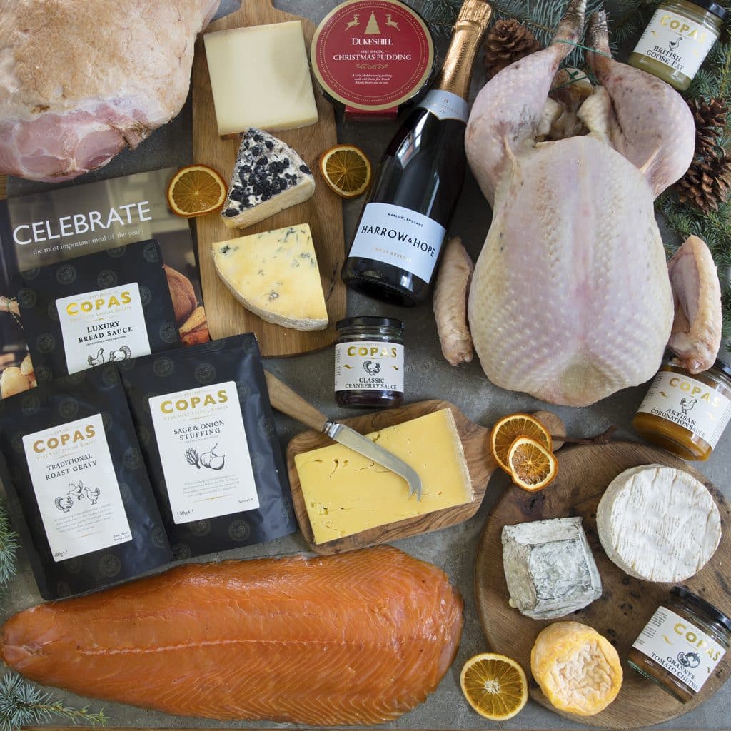 christmas food photography ofhamper laid out on table with turkey